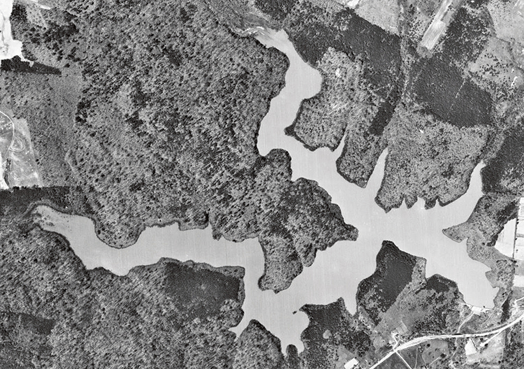 Black and white aerial photograph of the Alexandria Reservoir.